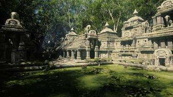 Ancient temple complex surrounded by lush greenery in Cambodia video