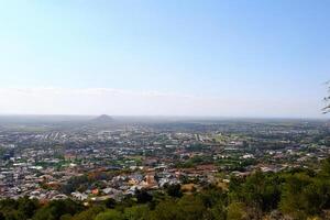 Hilltop Cityscape Panoramic View, Distant Mountain photo
