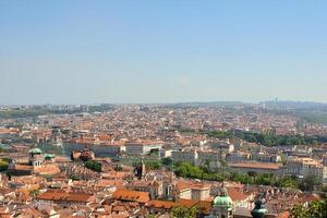 Cityscape panoramic view, summer day, hilltop, distant mountains photo