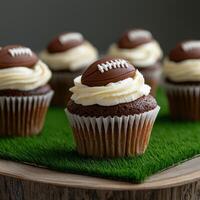 Chocolate cupcakes decorated with footballs for game day photo