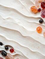 White cream texture background with colorful candies photo