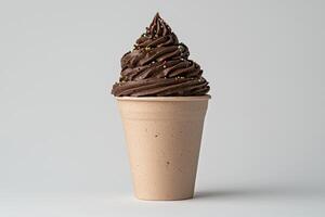 Chocolate soft serve ice cream in a paper cup with sprinkles photo