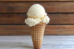 Two scoops of vanilla ice cream in a waffle cone photo