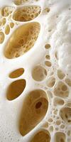 Close up of beer foam with intricate bubble structure photo