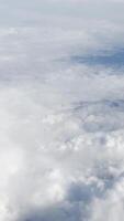 Fluffy clouds with soft texture at high altitude. Serene sky, tranquil atmosphere, dreamy horizon, ethereal aerial view, scenic cloudscape, and peaceful natural beauty. video