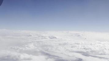 Aerial view of fluffy clouds and blue sky at high altitude. Serene horizon, peaceful atmosphere, dreamy cloudscape, scenic perspective, and breathtaking natural beauty. video