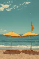 Two yellow umbrellas provide shade on a serene beach under a bright blue sky. photo