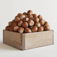 A wooden crate filled with fresh hazelnuts against a light background. photo