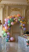 Elegant pastel balloon arch in a luxurious venue setting for a festive occasion. photo