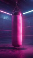 A vibrant pink punching bag hangs in a dimly lit boxing gym with neon lights. photo