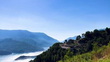 The view from the top of a mountain overlooking a river video