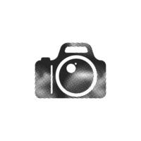 Camera icon in halftone style. Black and white monochrome vector
