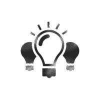 Light bulb icon in halftone style. Black and white vector