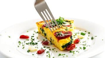 Spinach and Tomato Frittata Slice with Fork photo