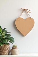 Photo frame of heart shape for mockup design on light wall background
