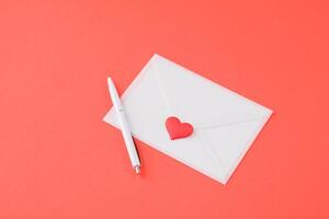 valentines day envelope on red background photo