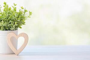Photo frame of heart shape for mockup design on light table background