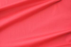red satin with folds and empty space for text or product placement photo