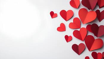 red hearts on a white background for Valentine's Day. red paper hearts border frame top view. paper heart in red color for romantic and love designs flat lay. paper red heart top view photo