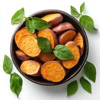 cut up sweet potato displayed on a clean white background with a shadow highlighting its vitamin rich content ideal for nutritious food concepts and healthy eating themes photo