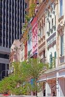 Colorful historic facade with modern high-rise contrast in Kuala Lumpur photo
