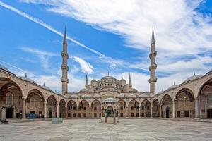 Sultan Ahmed Mosque courtyard with open space and historic Ottoman architecture photo
