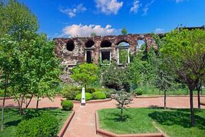 Ruins of the Byzantine walls in Istanbul surrounded by greenery photo