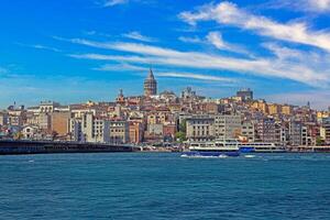 View of Galata district with Bosphorus and Galata Tower in Istanbul photo