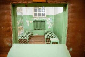 Vilnius, Lithuania - 30th november, 2024- kgb underground prison cells with bunk beds. The Museum of Occupations and Freedom Fights in Vilnius. Soviet occupation of Lithuania photo