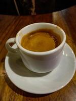 Espresso is coffee produced by brewing coffee at high pressure and temperature, resulting in a thick coffee extract. photo
