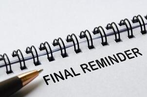 Final reminder text on white notepad. Action reminder concept photo