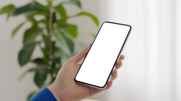 hand holding smartphone with white screen photo