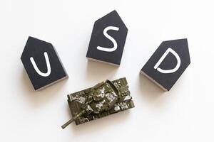 Word USD. Wooden small cubes with letters isolated on white background with copy space available.Business Concept image. photo