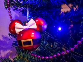 Christmas ball ornament in the shape of the mickey mouse head hanging photo