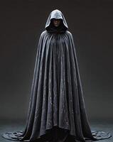 Mysterious Cloaked Figure in a Dark Background with Intriguing Textures photo