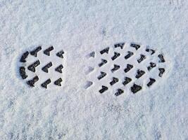 Footprints in fresh snow. Natural background with snow texture., copyspace. photo
