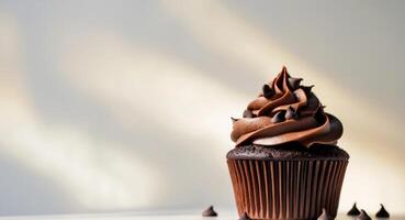 of chocolate cupcake with chocolate frosting and chocolate sprinkle photo