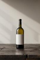 Elegant wine bottle with blank label on wooden table with copy spaceElegant wine bottle with blank label on wooden table with copy space. photo