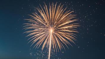 Golden firework exploding in the night sky.Golden firework exploding in the night sky. photo