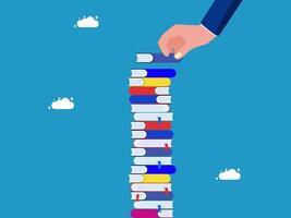 a hand is holding a stack of books vector