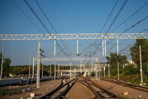 Railway Tracks with Overhead Power Lines photo