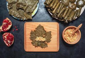 Stuffed Grape Leaves. Preparation of Dolma from grape leaves photo