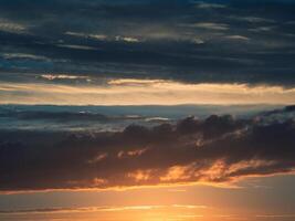 Dramatic sunset with a twilight blue color of the sky and clouds photo