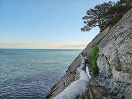 stone trail along the edge of the cliff in Crimea. photo