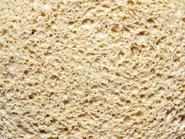 Cellular texture of yeast-free dough. White bread texture, closeup slice with macro surface details. photo