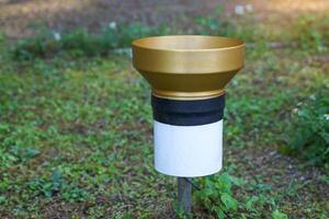 A rain gauge in a high mountain weather station is a meteorological instrument for measuring depth. of rainwater in an area of one square meter photo