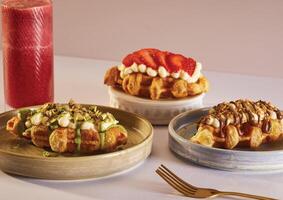 amiran a table topped with plates of food and drinks photo