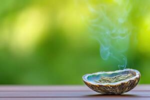 Native American smudging ceremony with burning sage in an abalone shell against a serene natural background photo