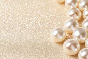Close-up of elegant pearls scattered on golden sand creating a luxurious and serene atmosphere with sparkling details photo
