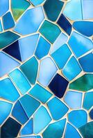 Modern mosaic design featuring turquoise, aquamarine, and soft blue tiles arranged in a dynamic geometric pattern photo